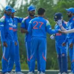 Cricket players on the field during an intense match between India-A and Sri Lanka-A at a large stadium.